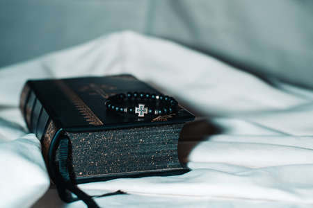 rosary lying on the Bibleの写真素材