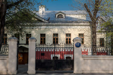 Old two-storey building number 13 in the center of Moscow, Russia. Entrance to the territory with...