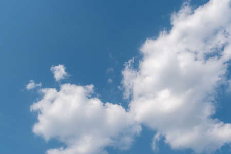 Beautiful fluffy clouds in the blue skyの写真素材