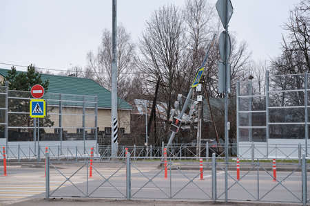 View of a pedestrian crossing with a falling traffic light. Security threat. Negligence of road...