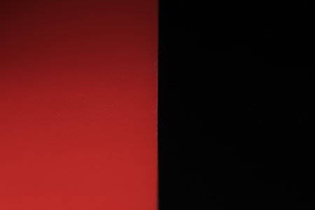 Abstract defocused red and black background. Space for lettering and design. close-up.の写真素材