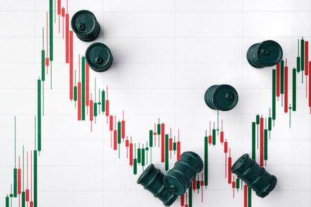Miniature barrels and graphs of stock fluctuations. selective focus. The concept of rise and fall in...