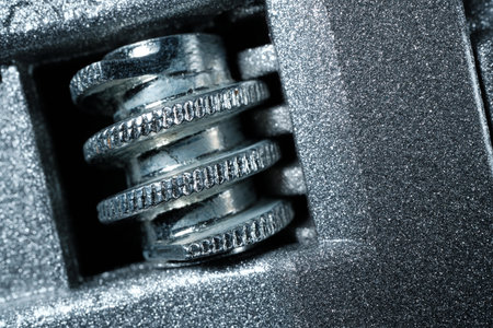 Close-up of a metal adjustment knob. abstract macro background.