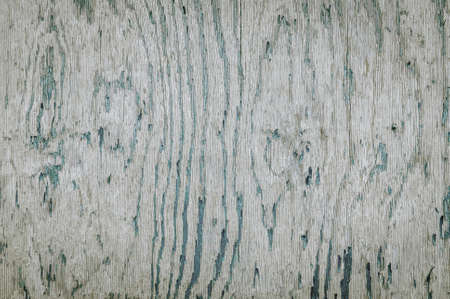 Horizontal color image of abstract close up of peeling paint texture