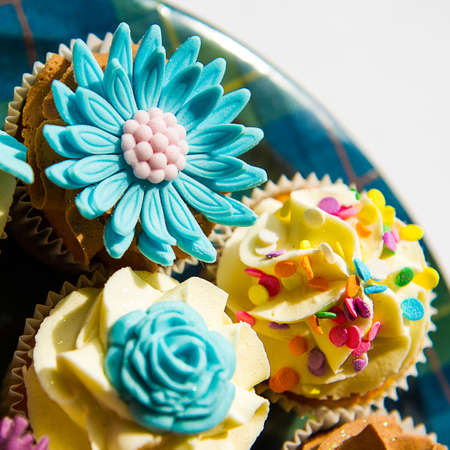 Square colour image of cupcakes on a plateの写真素材