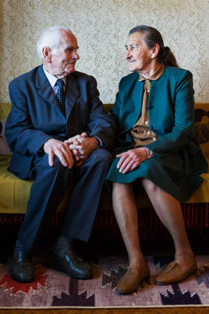 Cute 80 plus year old married couple posing for a portrait in their house  Love forever concept  の写真素材