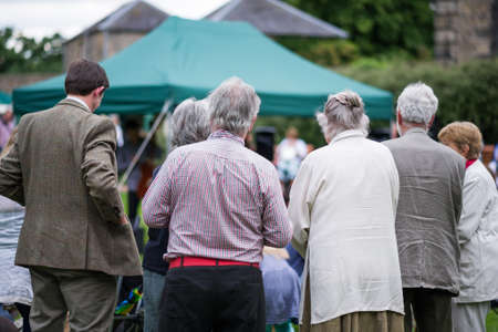 Older generation, seniors, enjoying an outdoors music, culture, community event, festival の写真素材