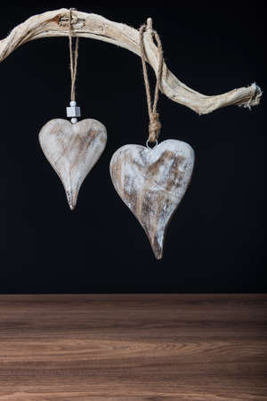 Retro vintage Christmas decorations hanging over black background with copy spaceの写真素材