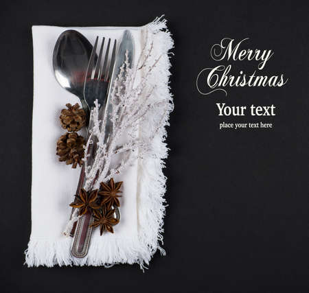 Christmas table setting, christmas menu concept in silver, brown and white color tone on dark grey background with copy text spaceの写真素材