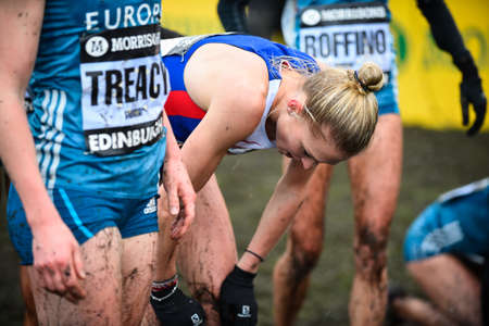 EDINBURGH, SCOTLAND, UK, January 10, 2015 - elite athletes exhausted after the Great Edinburgh Cross Country Run. Womanのeditorial素材