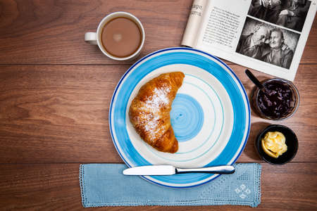 Continental breakfast with coffee, fresh croissants and good magazine