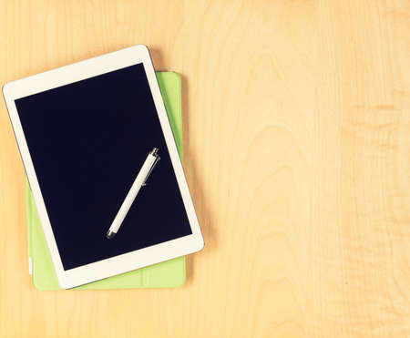 Office table with digital tablet. View from above with copy spaceの写真素材