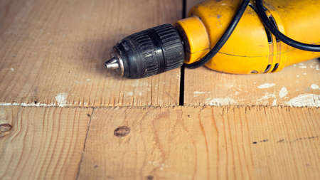 Electric well used power drill, close up with copy space