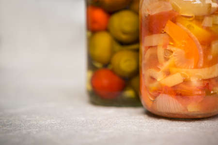 Jars of organic pickled vegetables. Marinated food. Clean eating conceptの写真素材