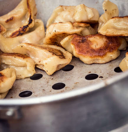 Filled fried dumplings, food market displayの写真素材