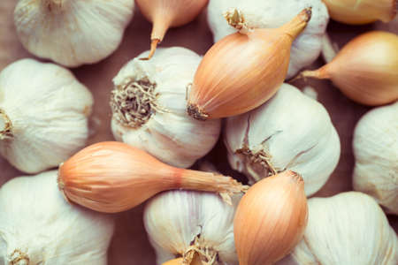 Fresh organic garlic and onions close up, clean eating conceptの写真素材
