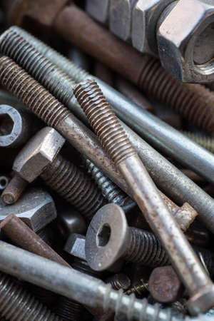 Old rusty metal screws detail shotの写真素材
