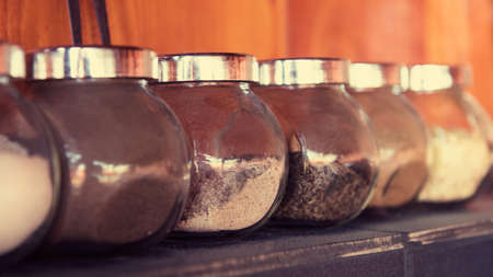 herbs and spices in glass jars, bbq areaの写真素材