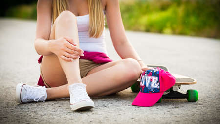 Anonymous teenage girl with skateboardの写真素材