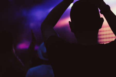 Anonymous man enjoying evening summer festivalの写真素材