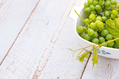 Grapes on white wooden vintage tableの写真素材