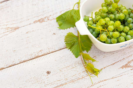 Grapes on white wooden vintage tableの写真素材