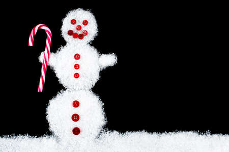 Funny smiling snowman on black background