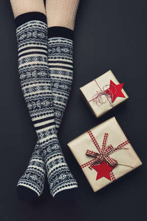 Long sexy woman legs with xmas over the knee socks. Christmas holiday concept. Top viewの写真素材