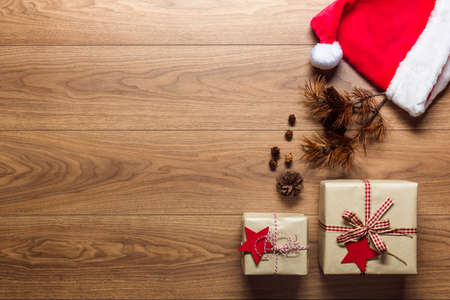 Beautiful presents, xmas concept, desk with santa hat, view from above with copy spaceの写真素材