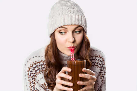 Gorgeous girl drinking hot chocolate, xmas spirit conceptの写真素材