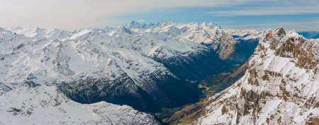 Scenery of snow covered mountains valley Titlis, Engelberg, Switzerland