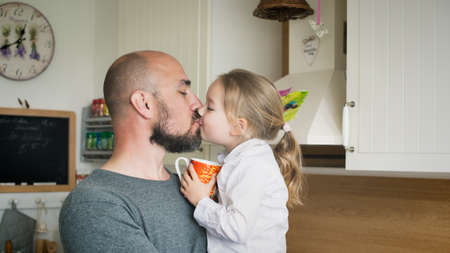 Father and daughter in the kitchen, fathers day concept, real familyの写真素材