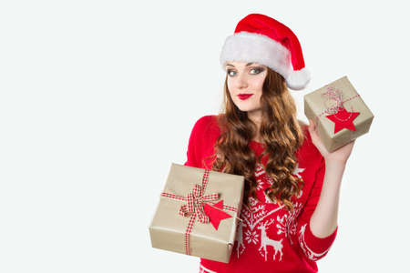 Gorgeous woman holding beautifuly wrapped presents, xmas concept on white background