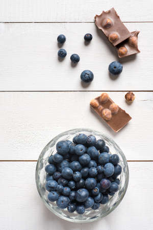 Chocolate with hazelnuts and blueberriesの写真素材