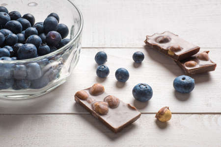 Chocolate with hazelnuts and blueberriesの写真素材