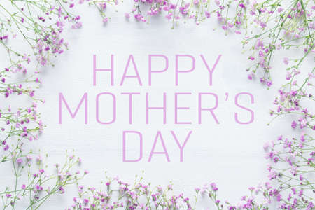 Mother's day background, white wooden table with pink flowersの写真素材