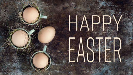 Uncolored natural easter eggs in green espresso cups, happy easter concept, retro easter backgroundの写真素材