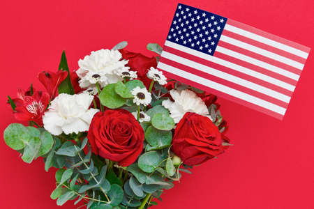 Beautiful bouquet with american flag on red backgroundの写真素材