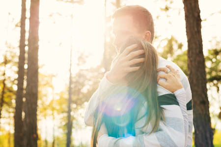 Happy young couple in love hugging. Park outdoors date. Loving couple happiness.