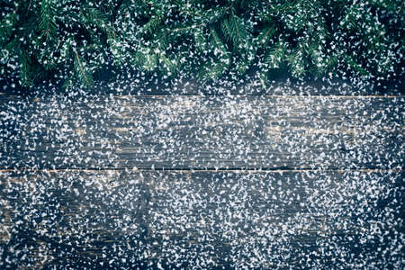 Snowy Christmas Background, Fir Tree Branches On Wooden Background, Festive Banner With Copy Spaceの写真素材