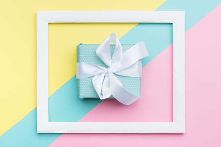 Happy Mother's Day, Women's Day, Valentine's Day or Birthday Pastel Candy Colours Background. Flat lay minimalism geometric patterns greeting card with a gift box.の写真素材