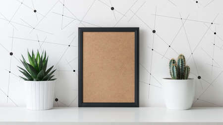 Modern room decoration. Various cactus and succulent plants in different pots. Mock-up with a black frame.の写真素材