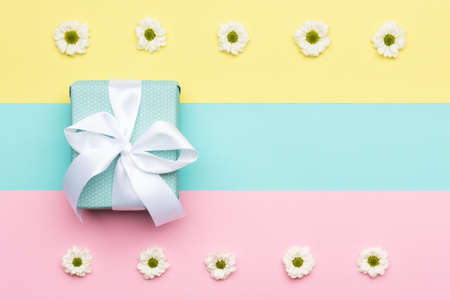 Floral flat lay minimalism greeting card with a gift box.の写真素材
