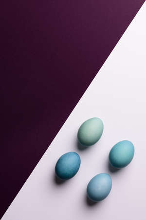 Happy Easter black and white background. Hand painted blue Easter eggs abstract minimal concept.の写真素材