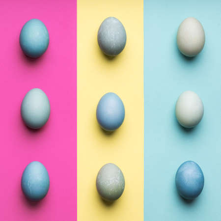 Happy Easter pastel coloured background. Hand painted Easter eggs abstract minimal concept.