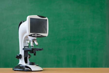 Modern digital microscope with LCD display.