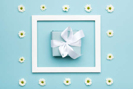 Happy Father's day Pastel Blue Candy Colours Background. Flat lay minimalism greeting card with picture frame and beautiful present.の写真素材