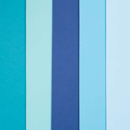 Abstract geometry flat lay pastel blue and turquoise colored paper texture minimalism background....
