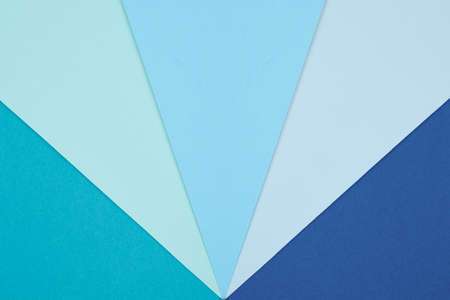 Abstract geometry flat lay pastel blue and turquoise colored paper texture minimalism background....