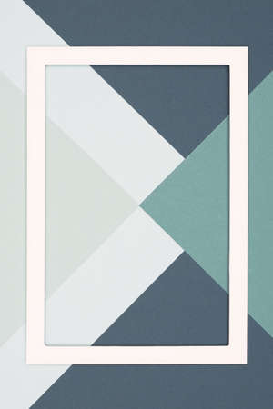 Abstract geometrical cold grey and green colored flat lay paper background. Minimalism template with...